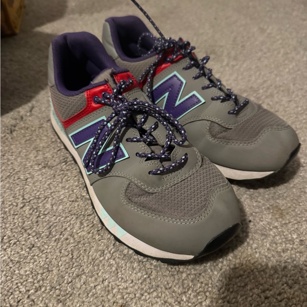 New Balance Gray Sneakers with Red and Blue Accents
